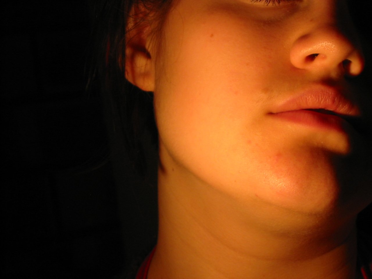 close up s of a woman's face with sunbeams on