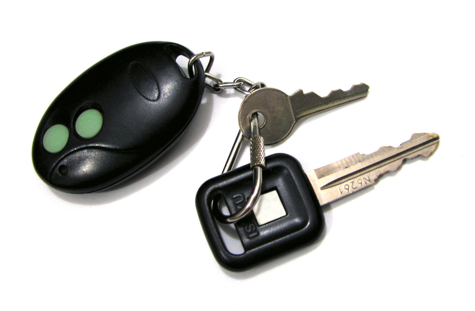 a pair of keys on a key chain with a white background