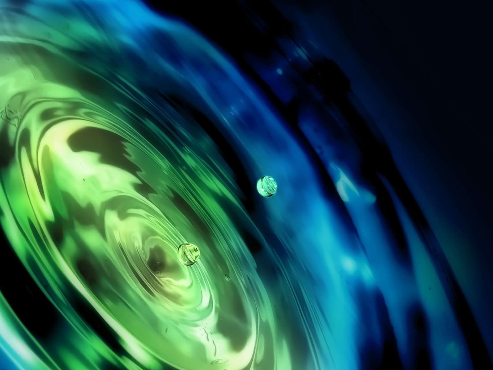 a background consisting of swirling circles and blue, green and black colors