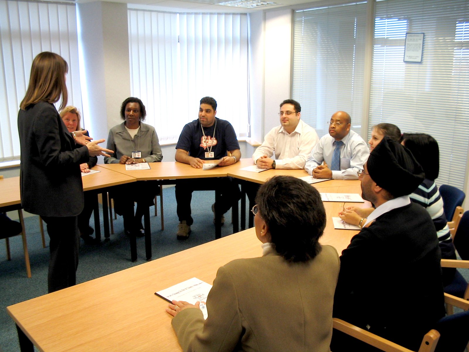 a group of people seated around a round table