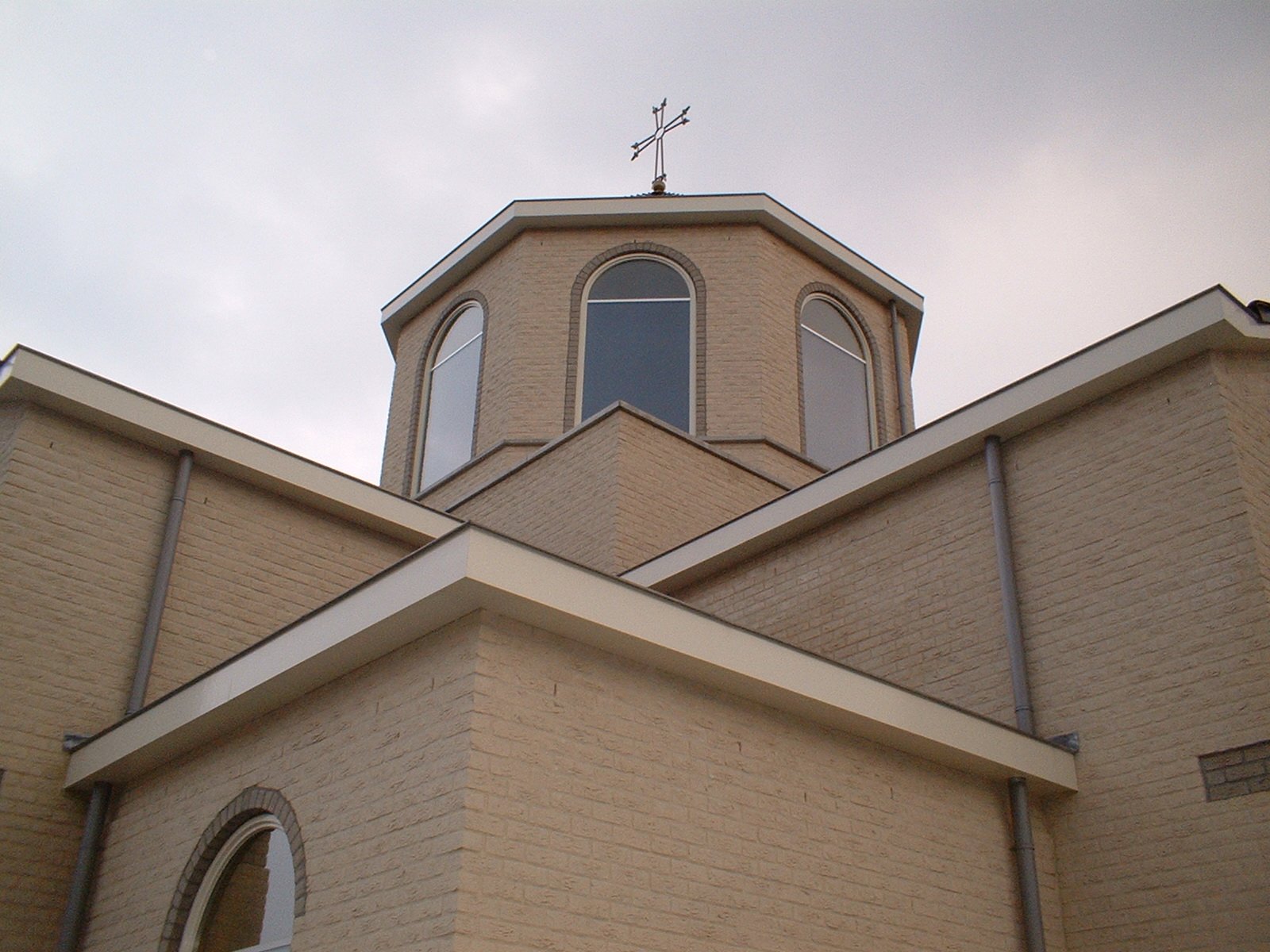 an angled view of a church's front of building with a steeple