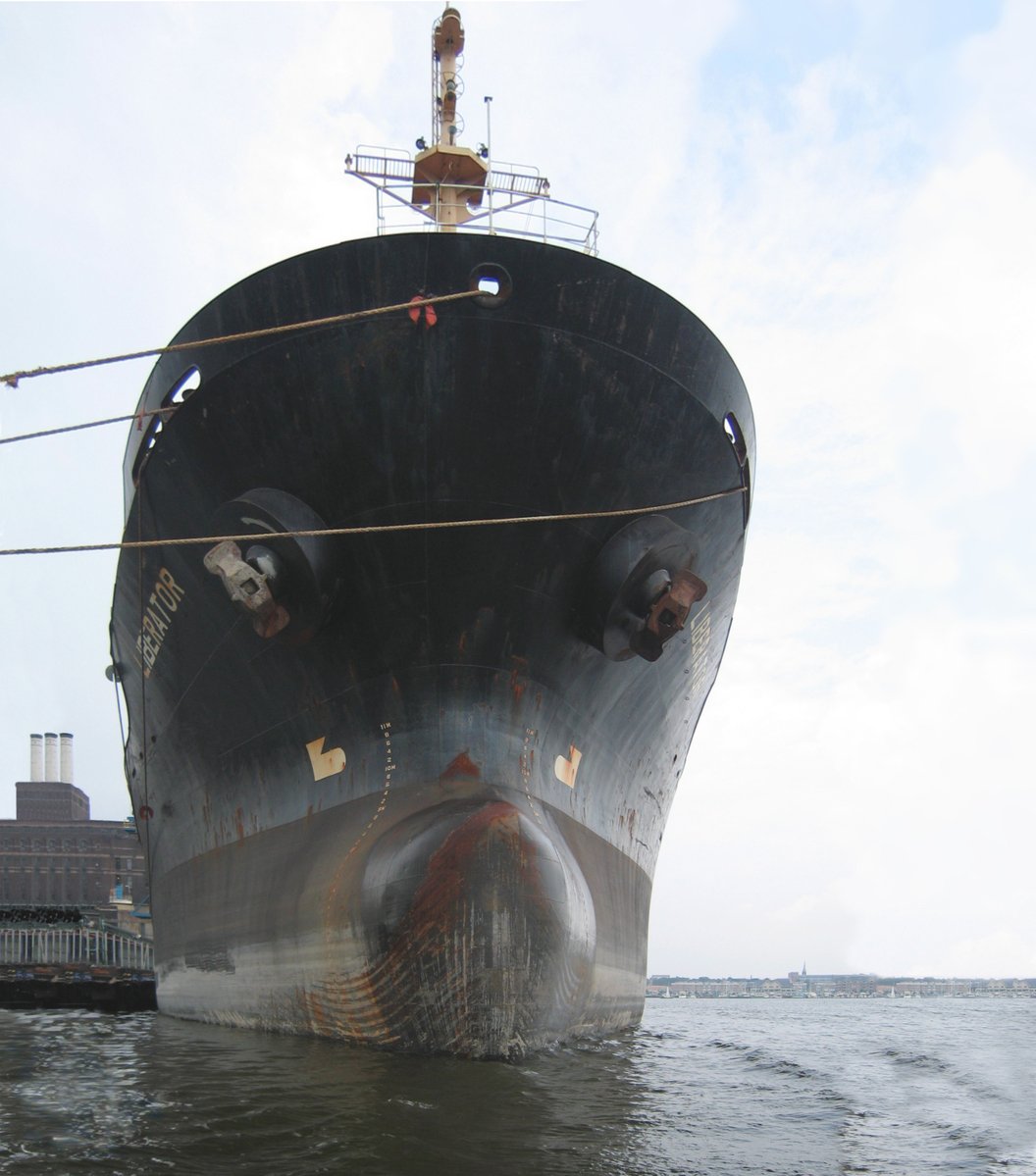 a large ship is parked at a dock