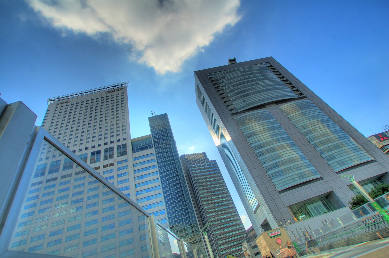 a cloud hovers over many skyscrs in this city