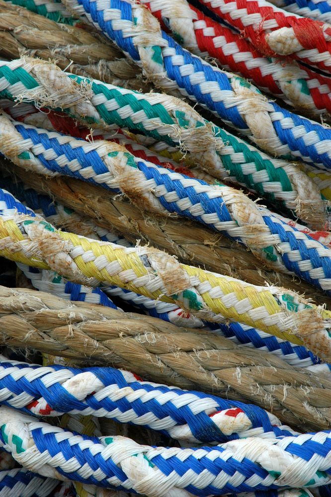 many ropes are tied together on a wall