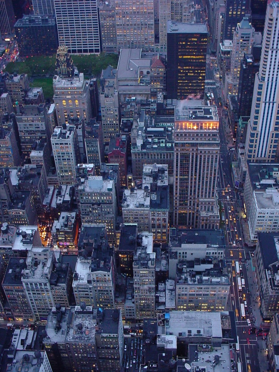 an aerial view of a city with many tall buildings