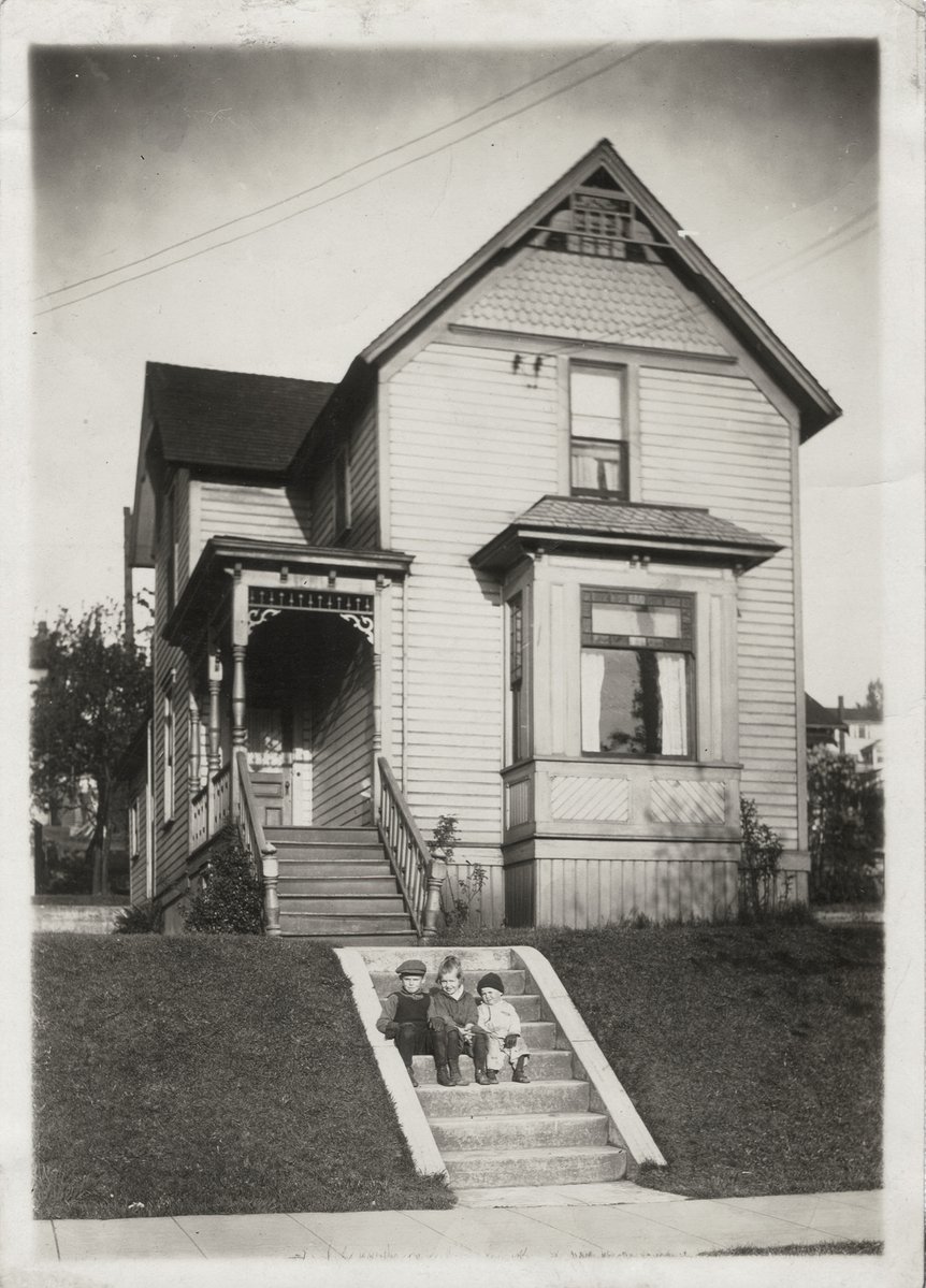 old pograph of an older house on the corner