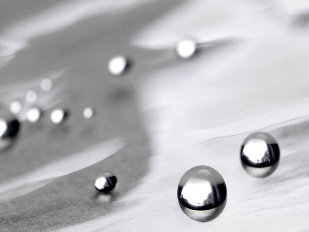 an image of water droplets in black and white