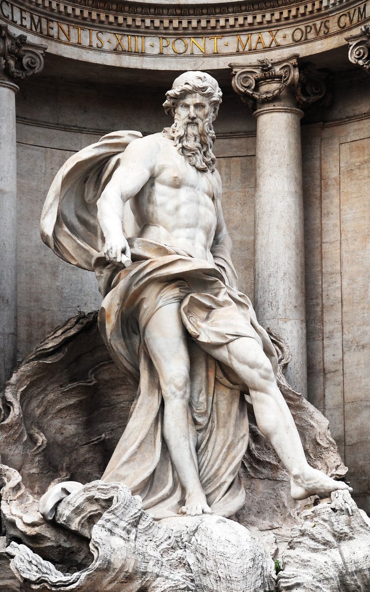 statue in front of a dome with an inscription on it