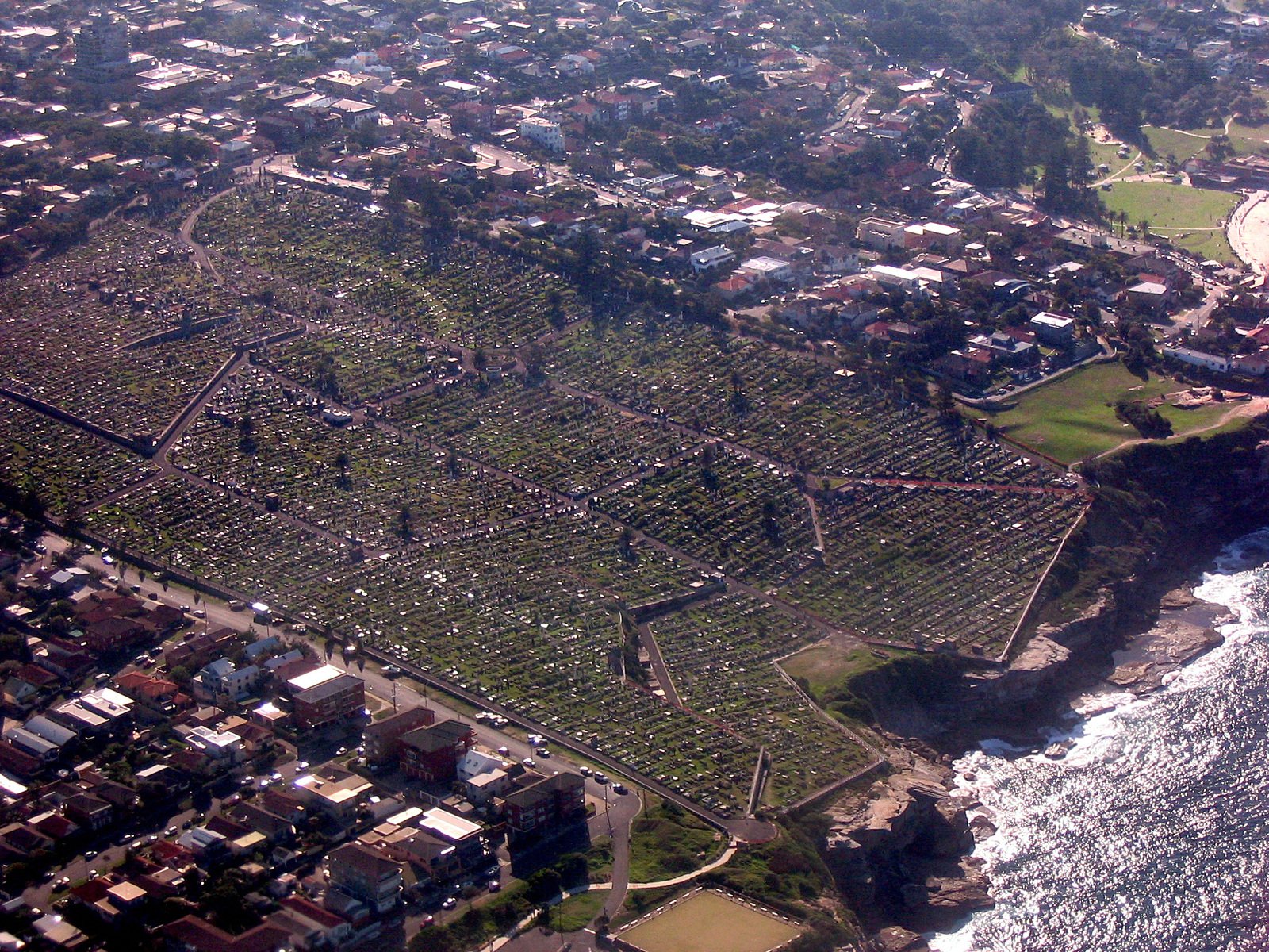 a city seen from above with many buildings and the water