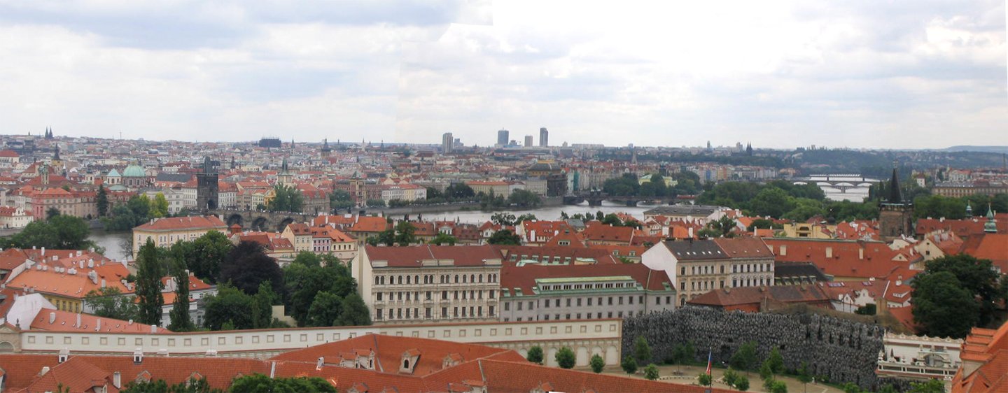 many old and new buildings line the side of a river