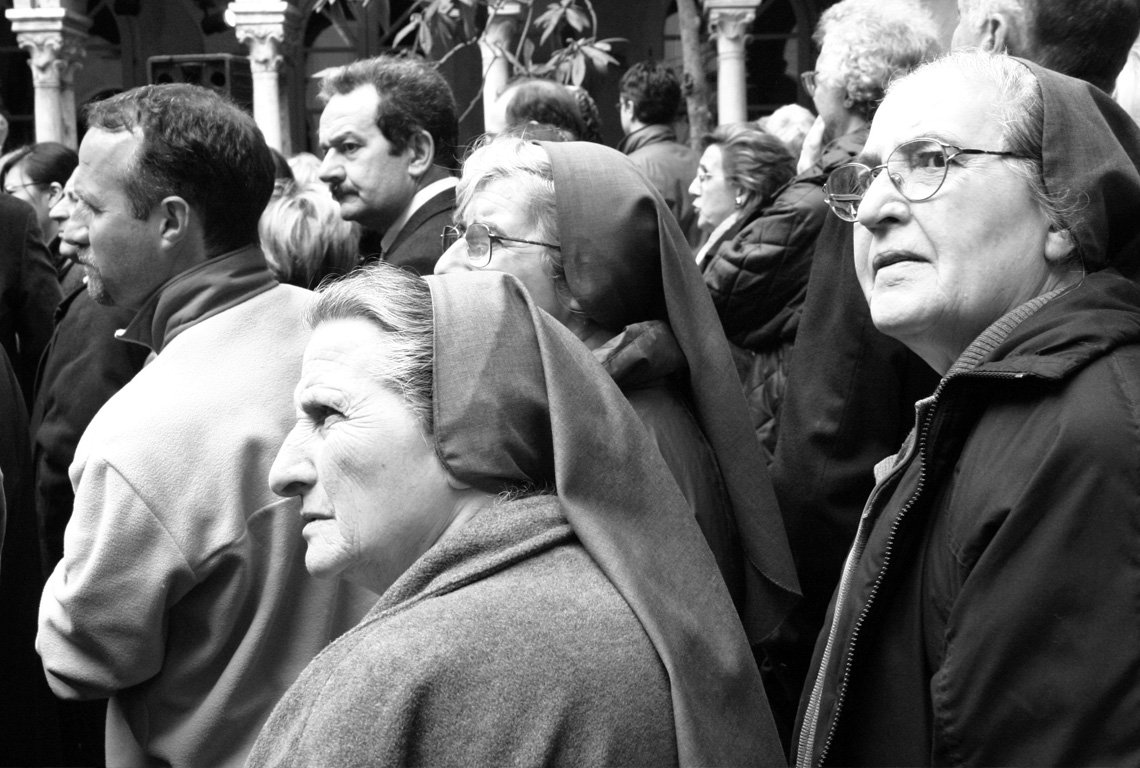 black and white pograph of people wearing headscarves