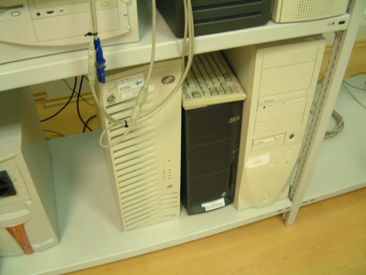 a row of servers with cables and plugins attached