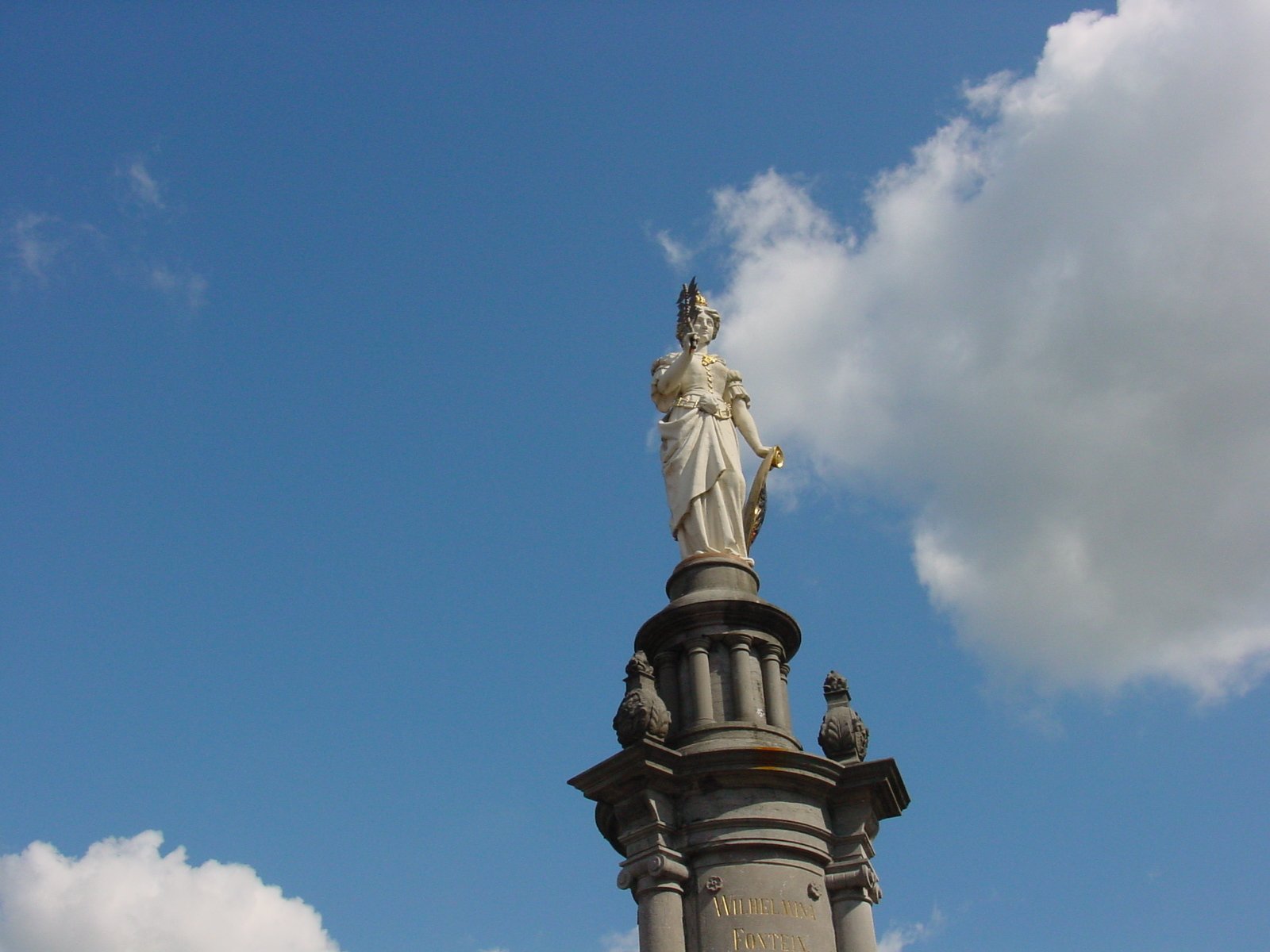a large statue on top of a tower