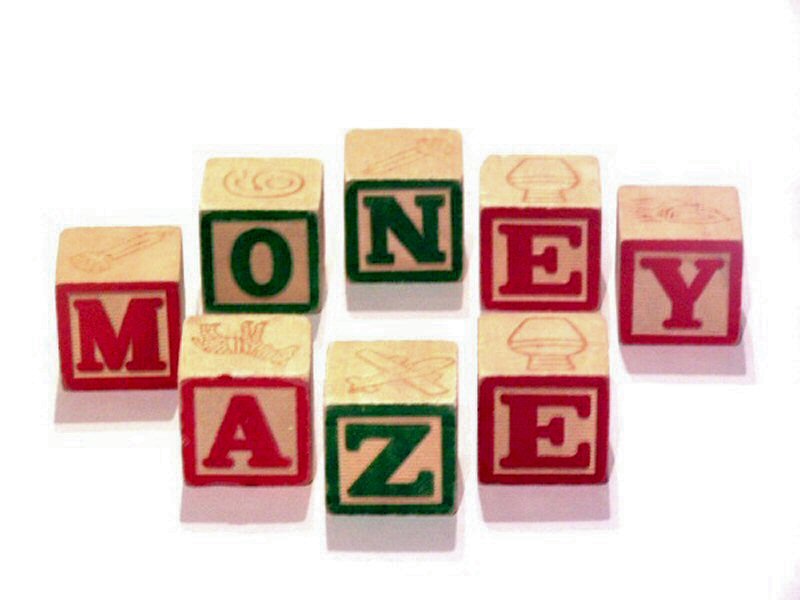 wooden blocks with words spelling money on them
