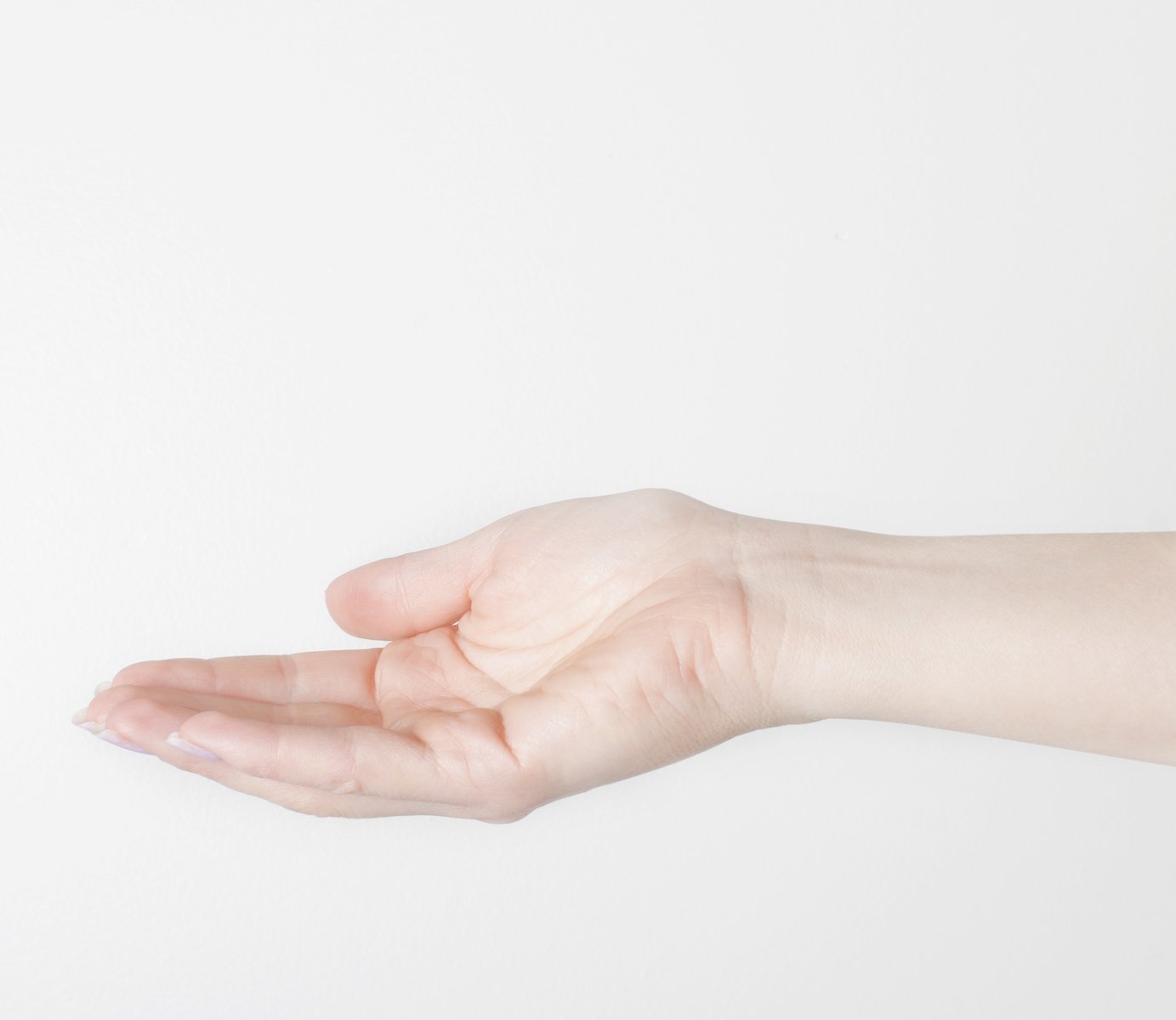 hand holding soing on white surface with white background