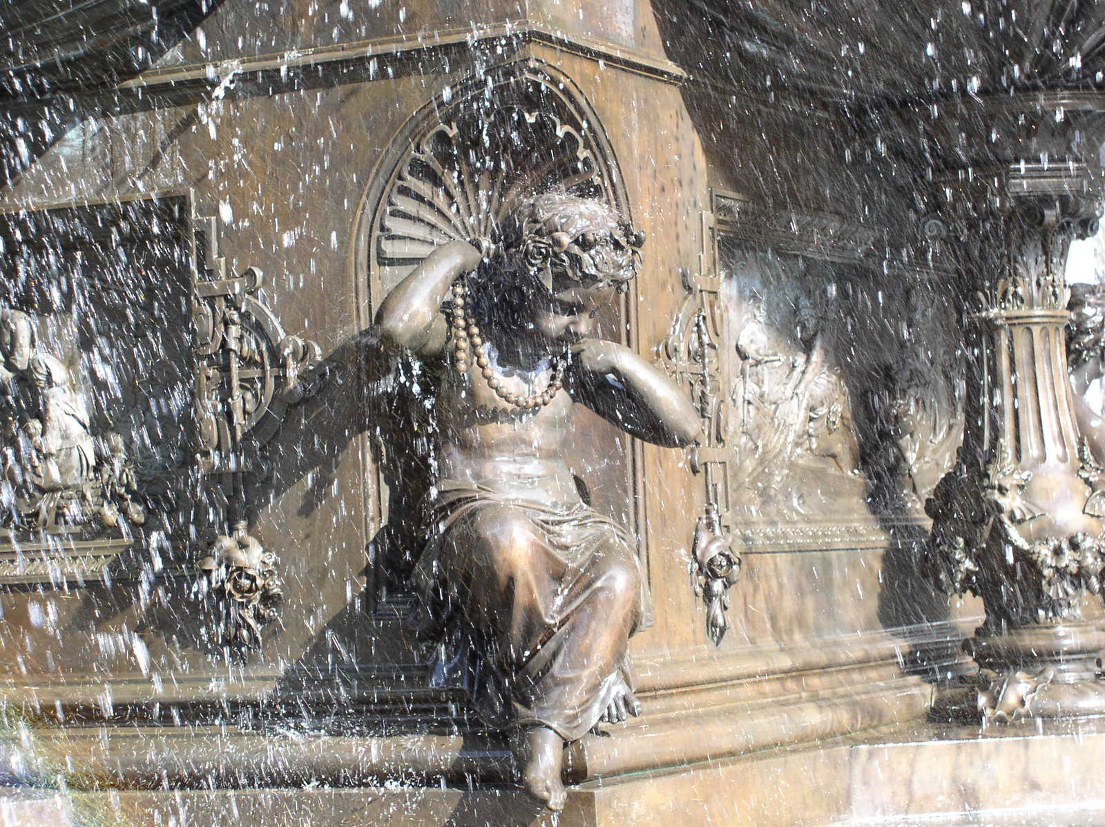 a fountain that has a statue in it