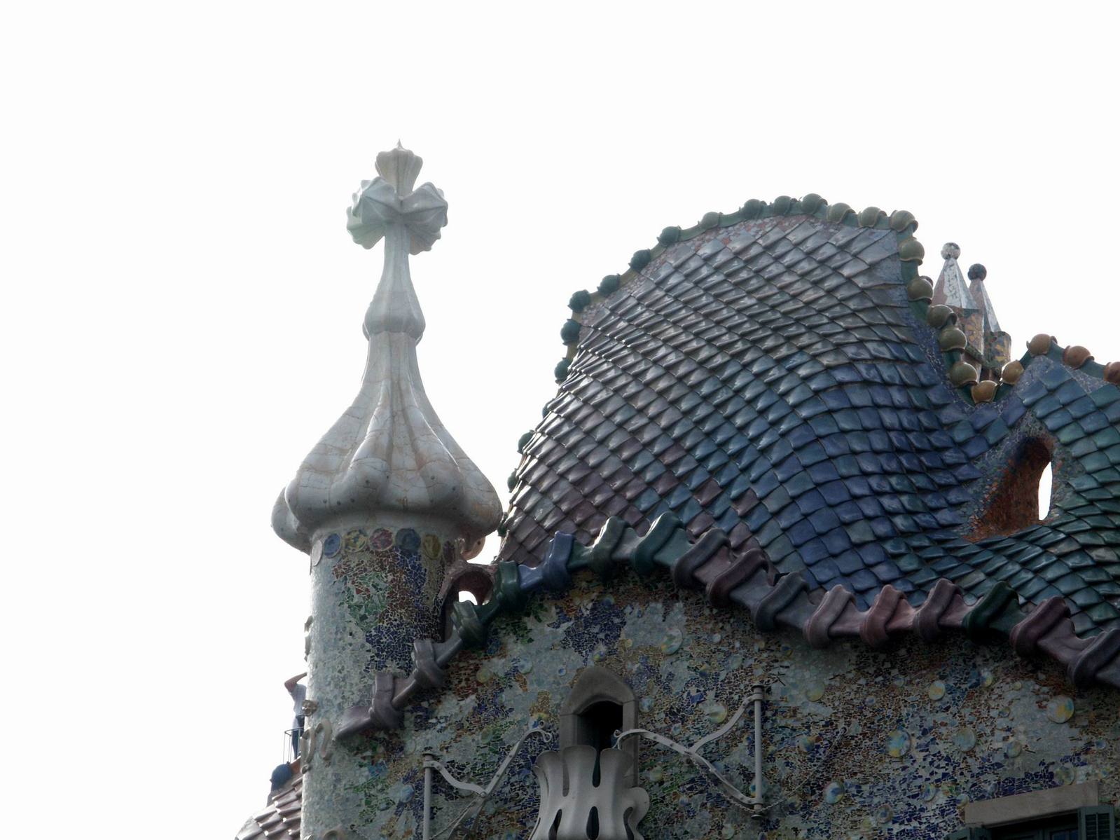 the roof is made of ceramic tiles and has an unusual roof top