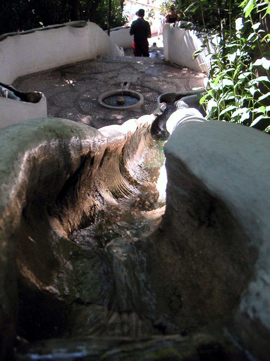 an unusual looking rock in a circular basin