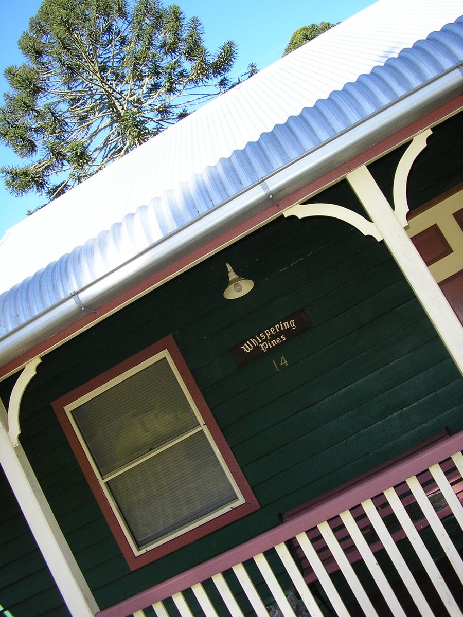 the front porch of a small house with decorative design