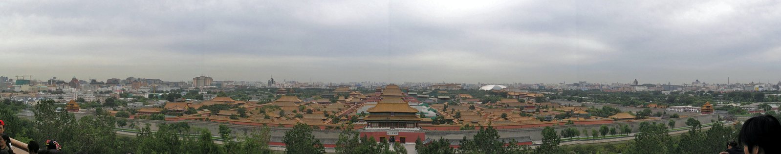 people look out over the city from a viewpoint point