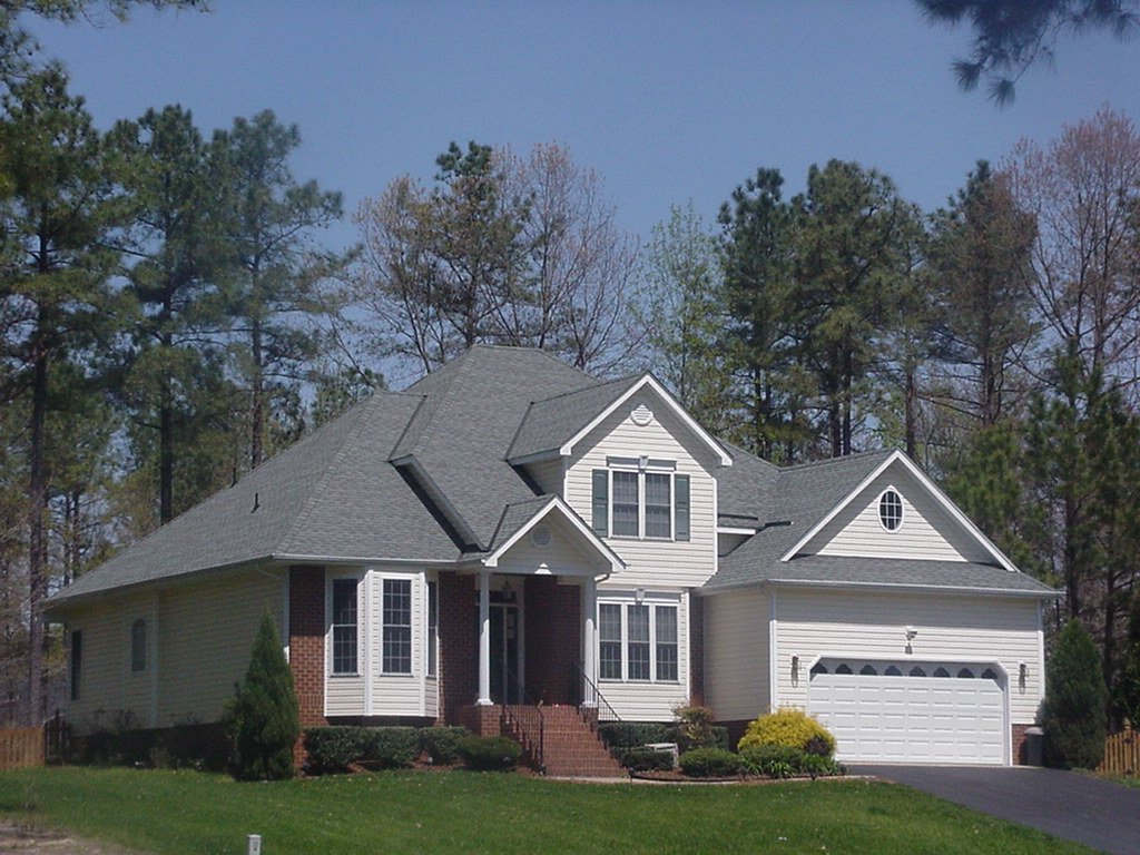 a large white house on the side of the road