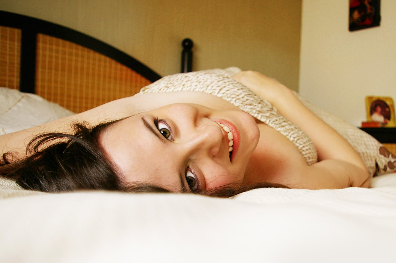 an image of a woman laying down on the bed