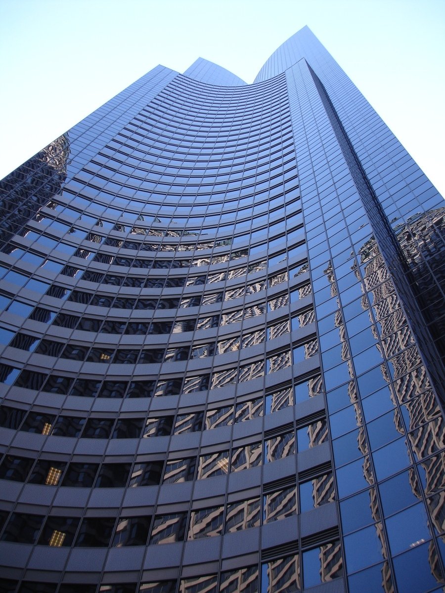 the tall skyscr has many windows along it