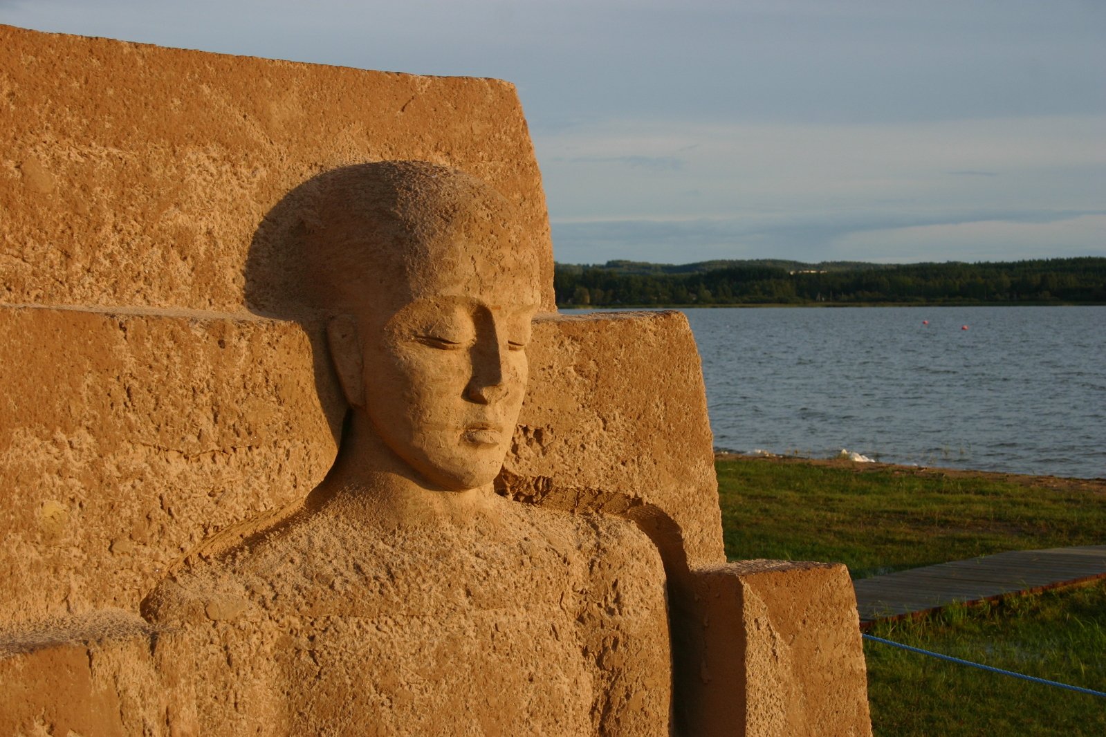 an ancient statue of the egyptian god ostus is shown at the edge of the water