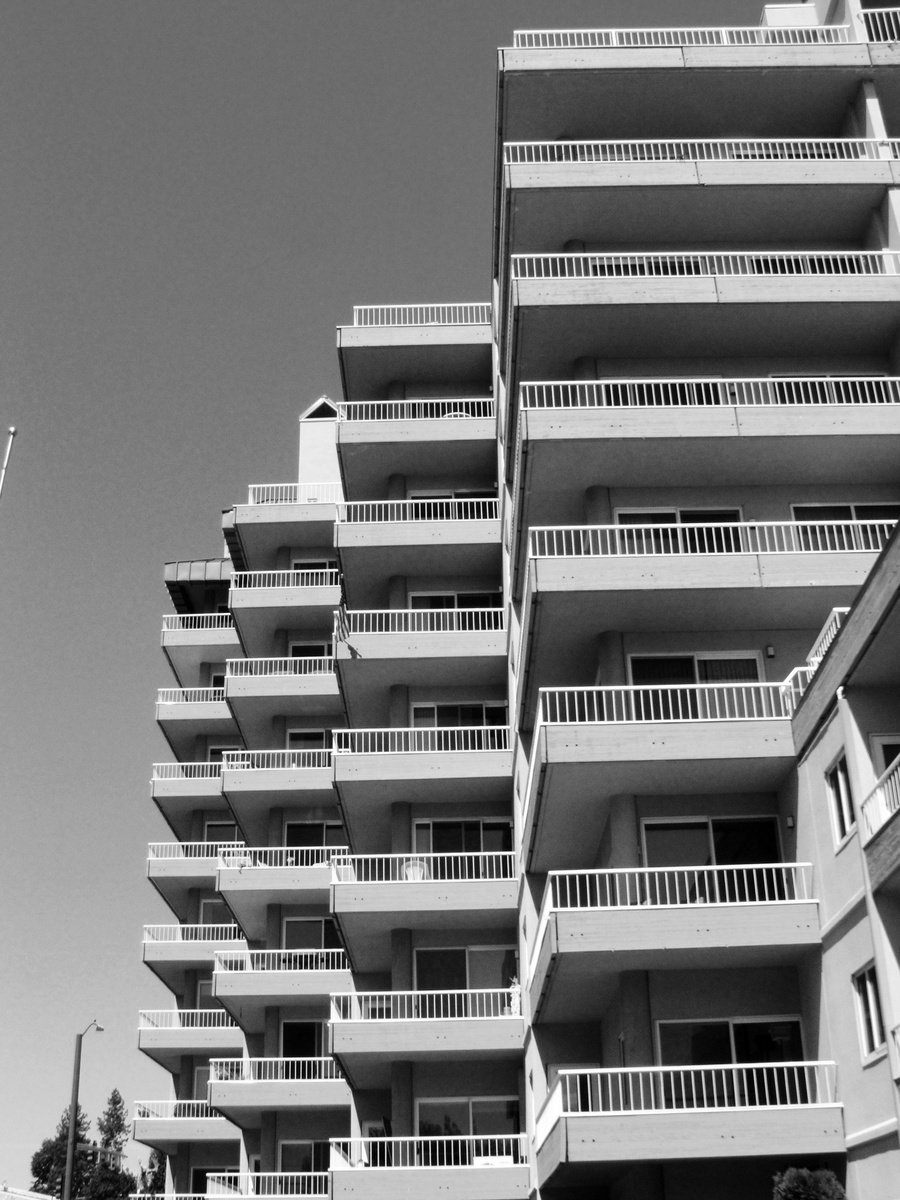 the black and white pograph of apartment buildings