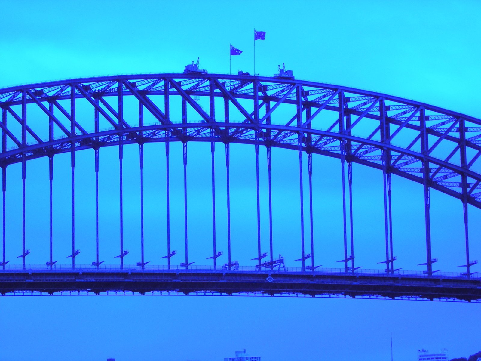 a bridge with boats crossing under it