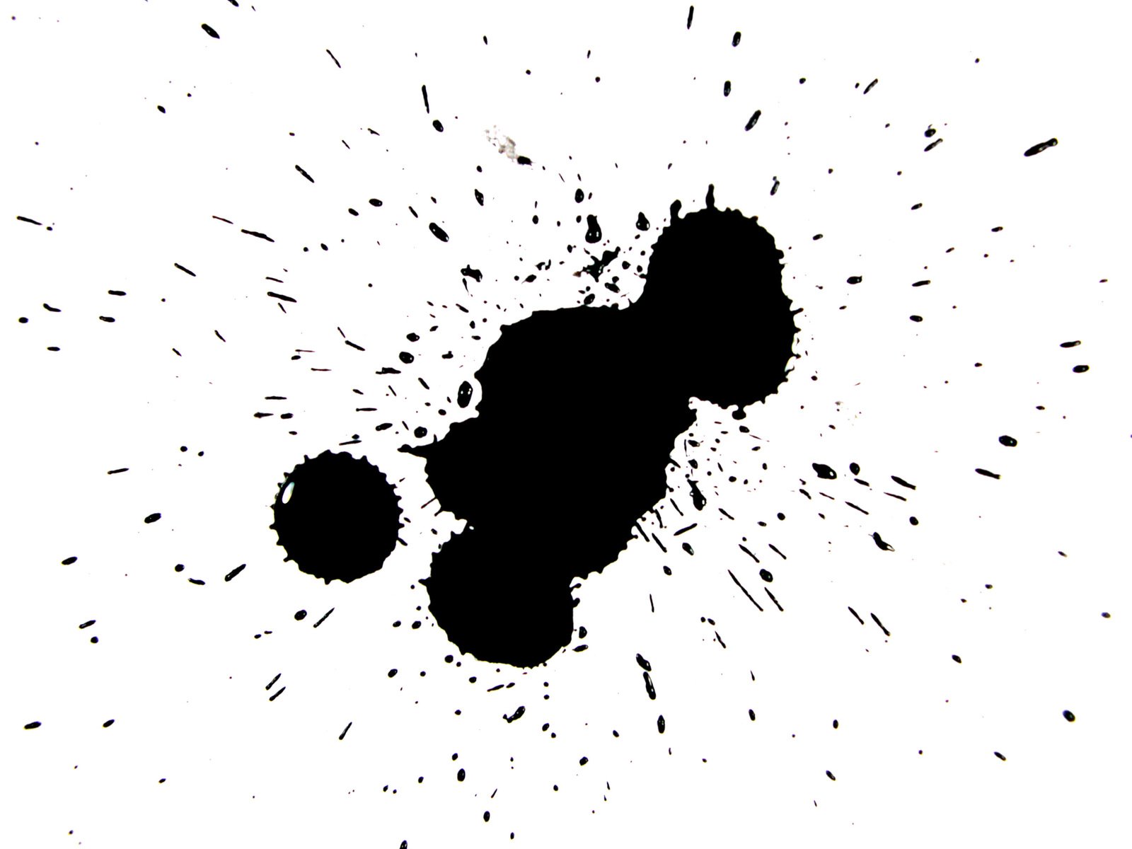 a black ink splattered drop on white background