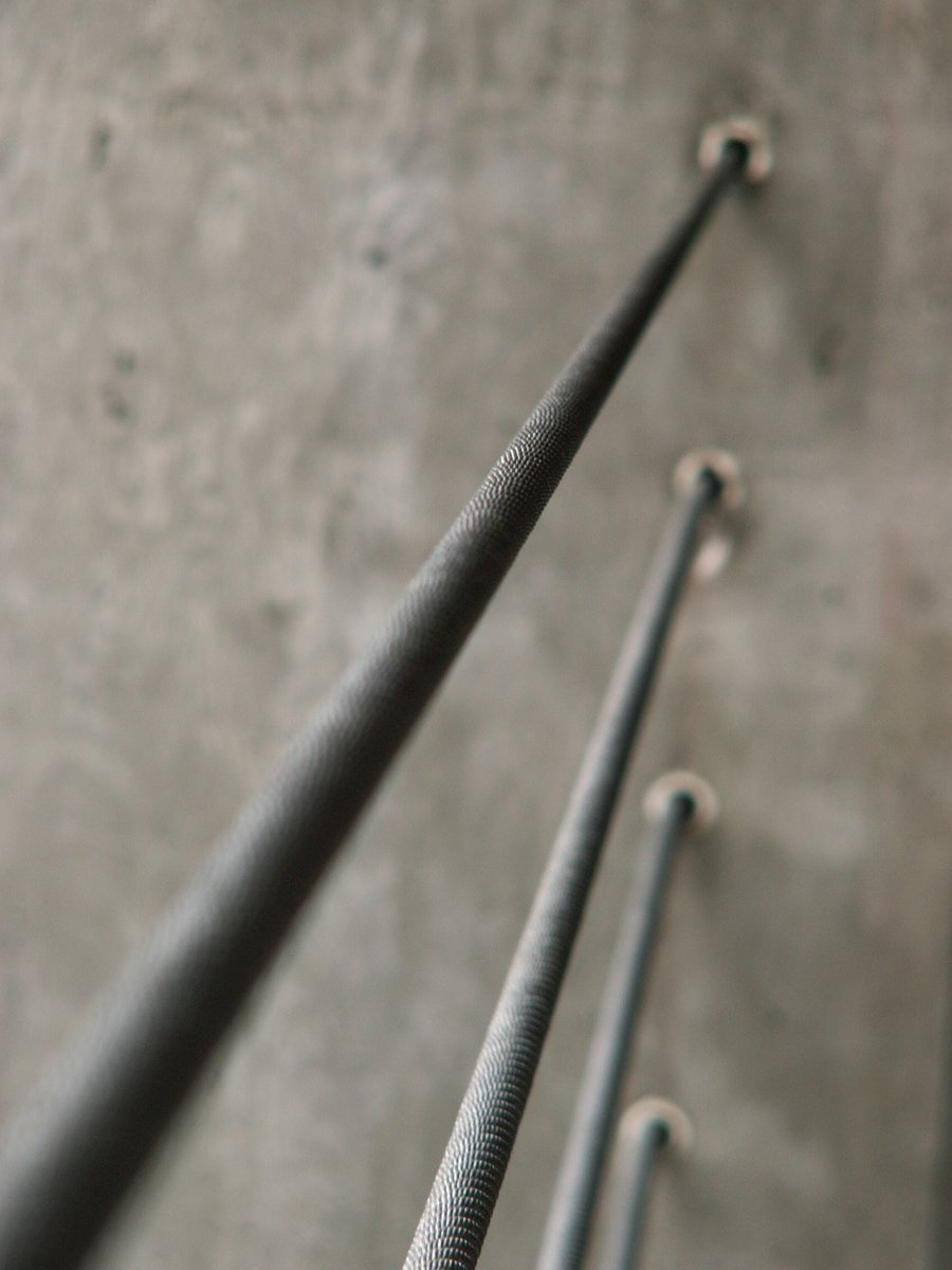 a group of metal objects against a wall