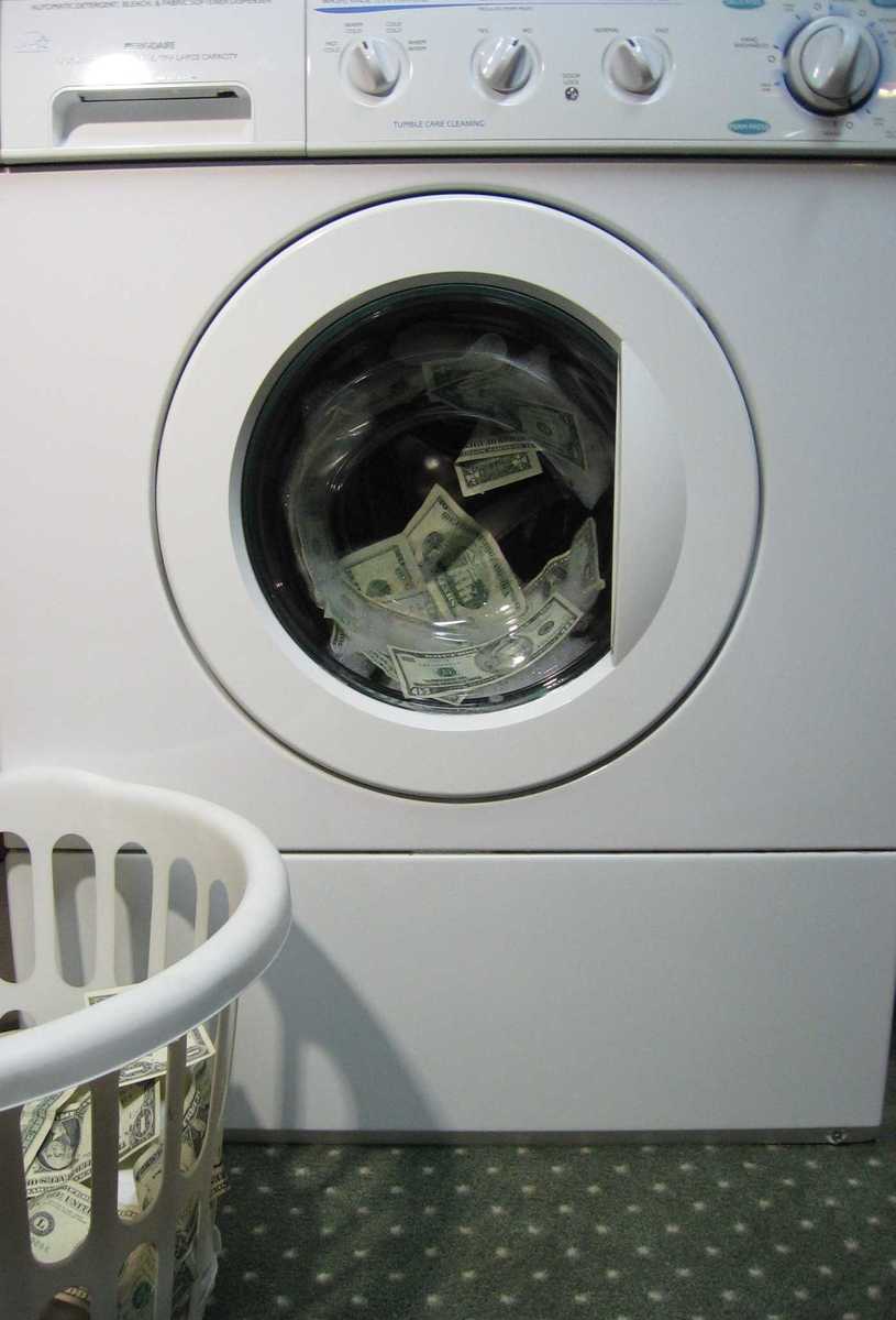 a washing machine with money bill in it