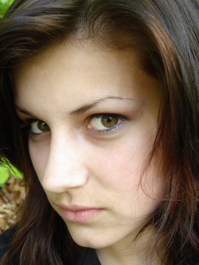 a close up of a person with long dark hair