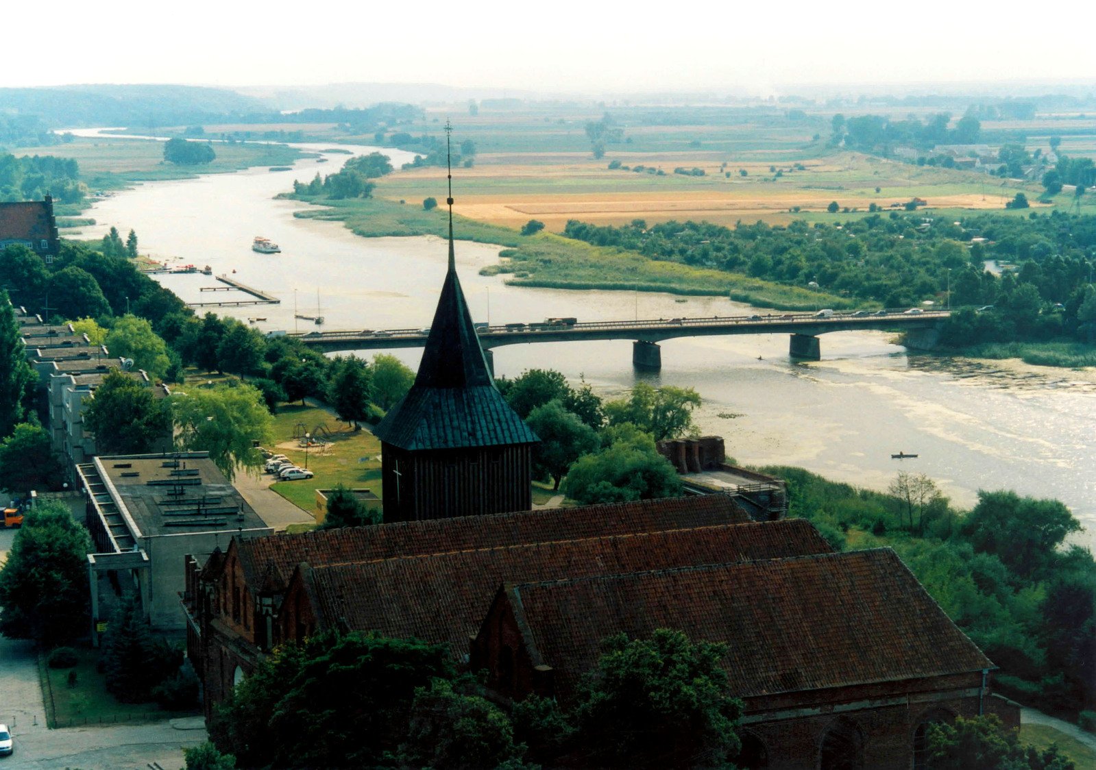 a river and church is featured in this pograph