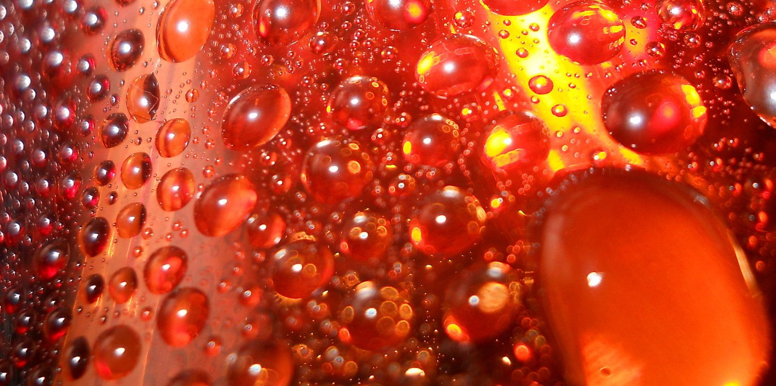 bubbles in oil and water reflecting off a mirror