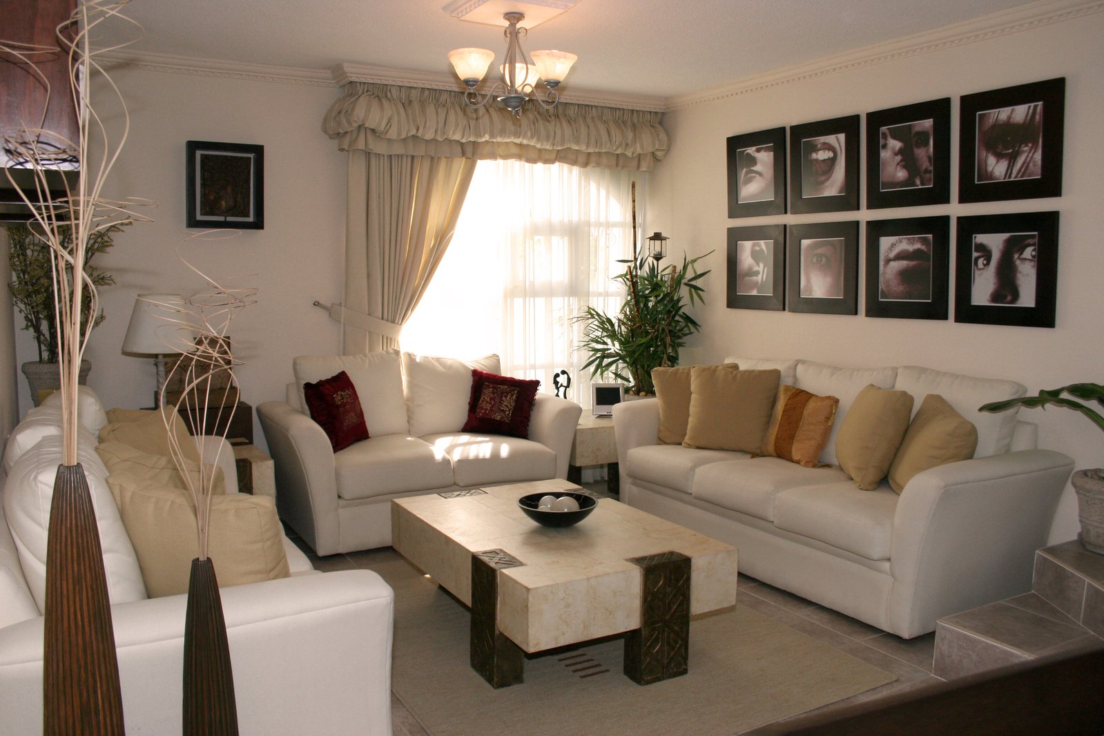 a well decorated living room has white couches