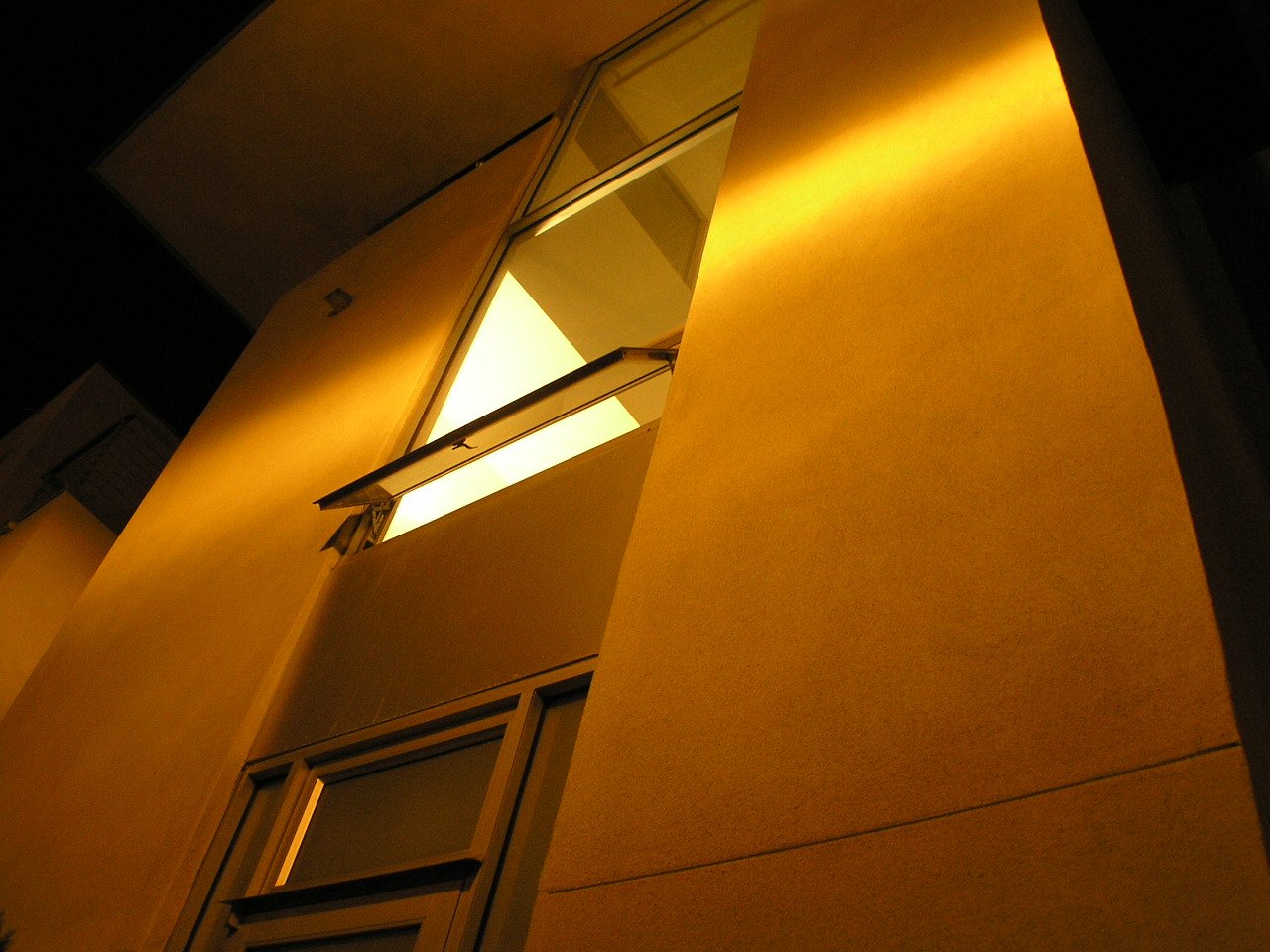 the building is illuminated by a lit up window