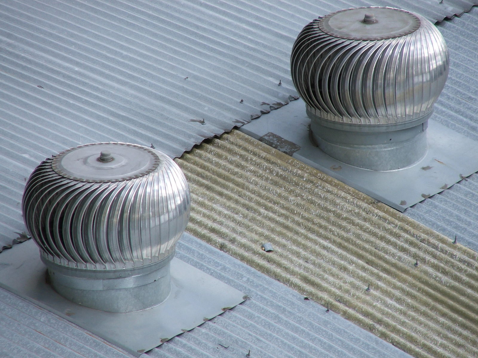 a couple of grey round pedestals sitting next to each other