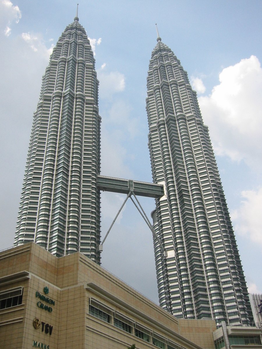 two towers sticking out of a tall building