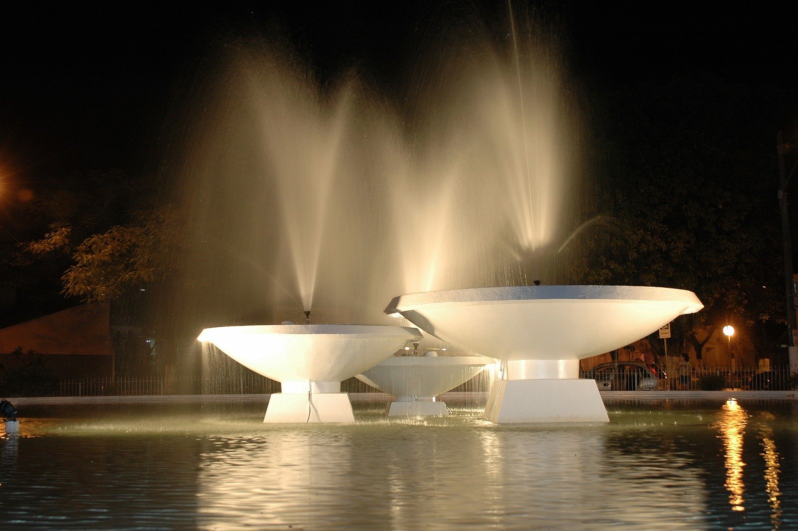 a fountain with water shooting at the top