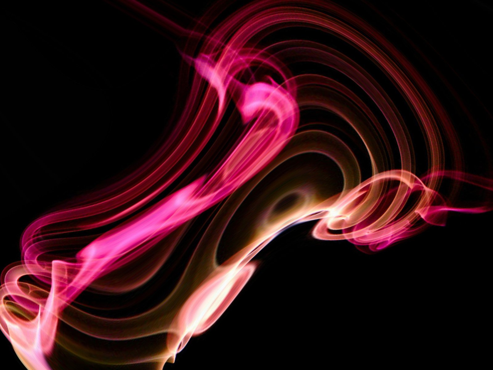a pink swirl on a black background