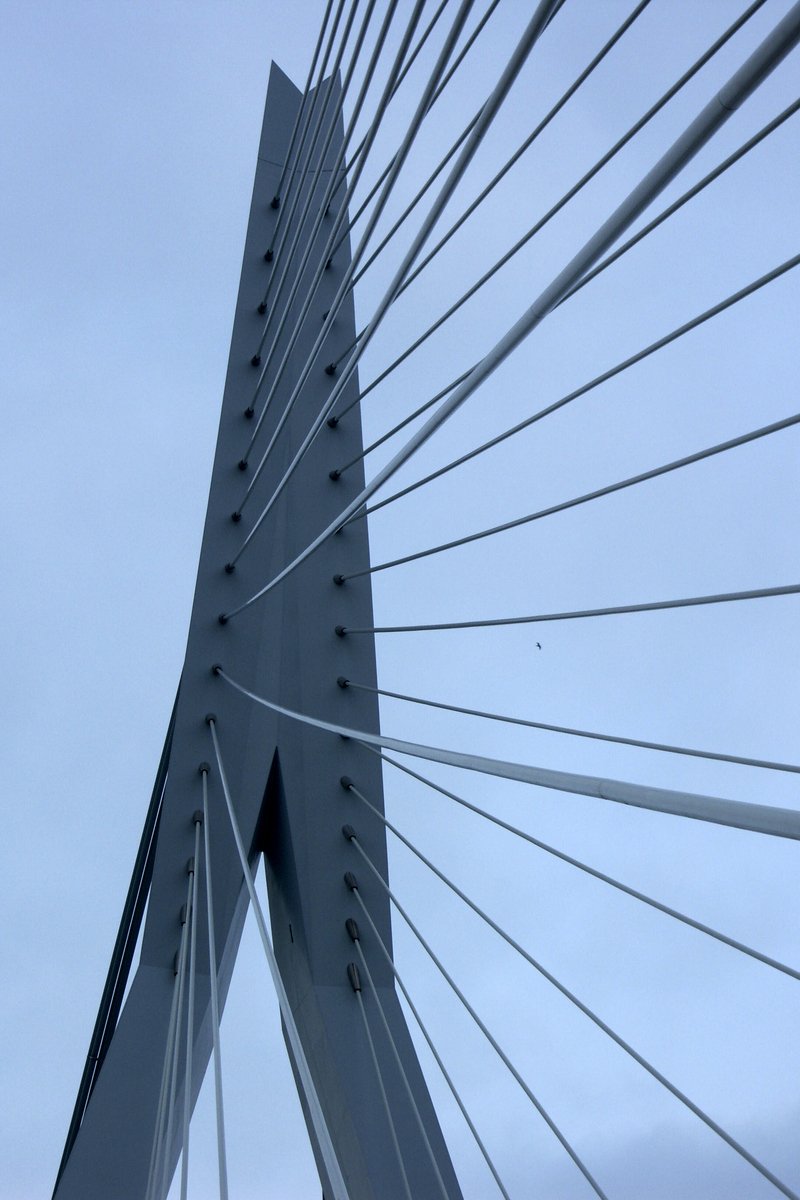 looking up at a view of the underside of a bridge