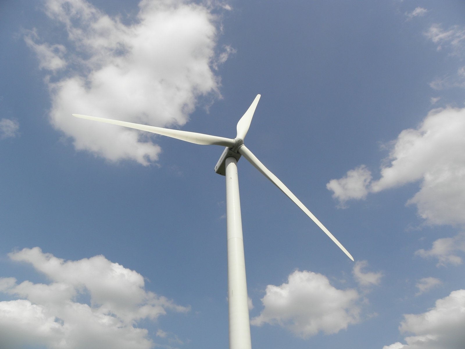 a wind turbine in the middle of the day