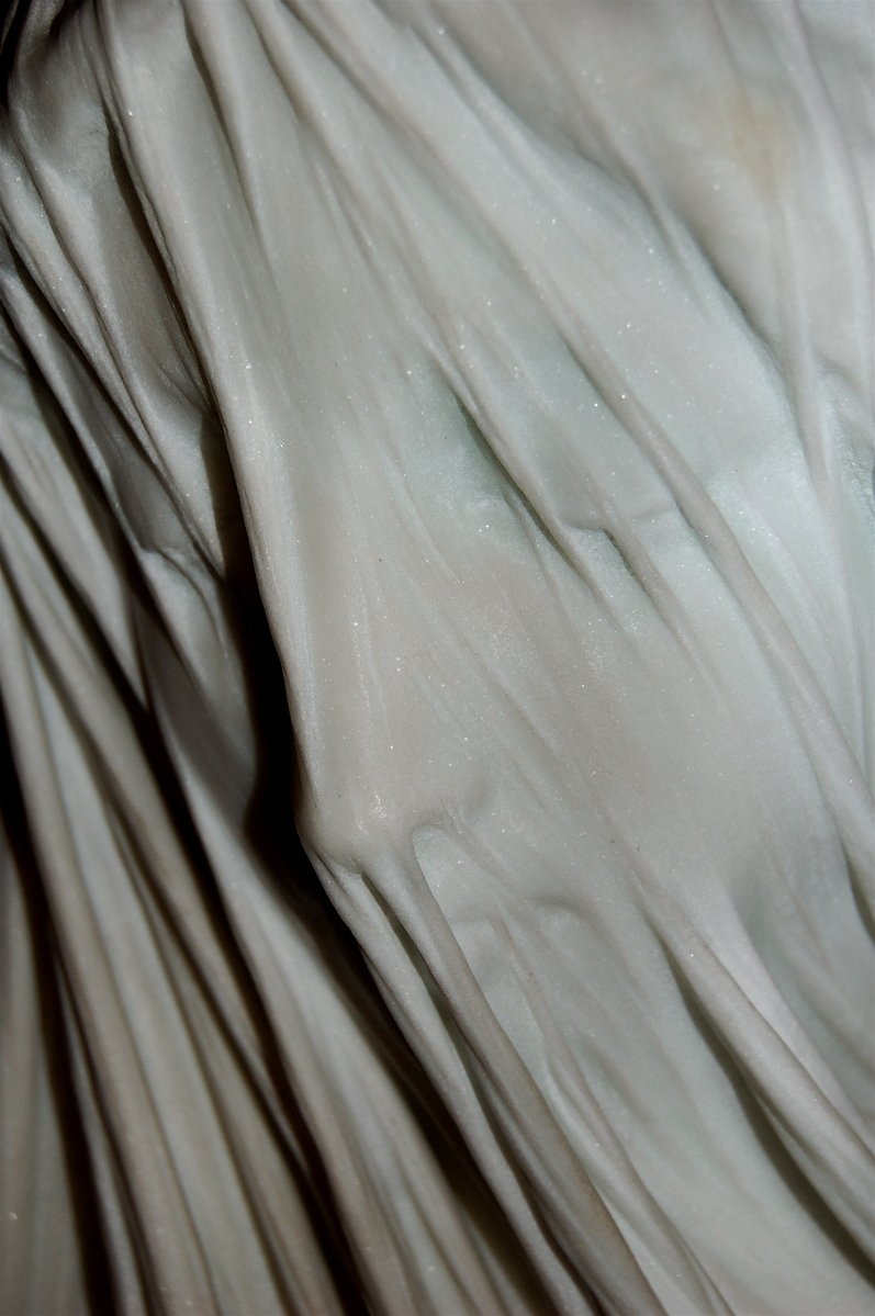 this is the side view of a white sheer curtain