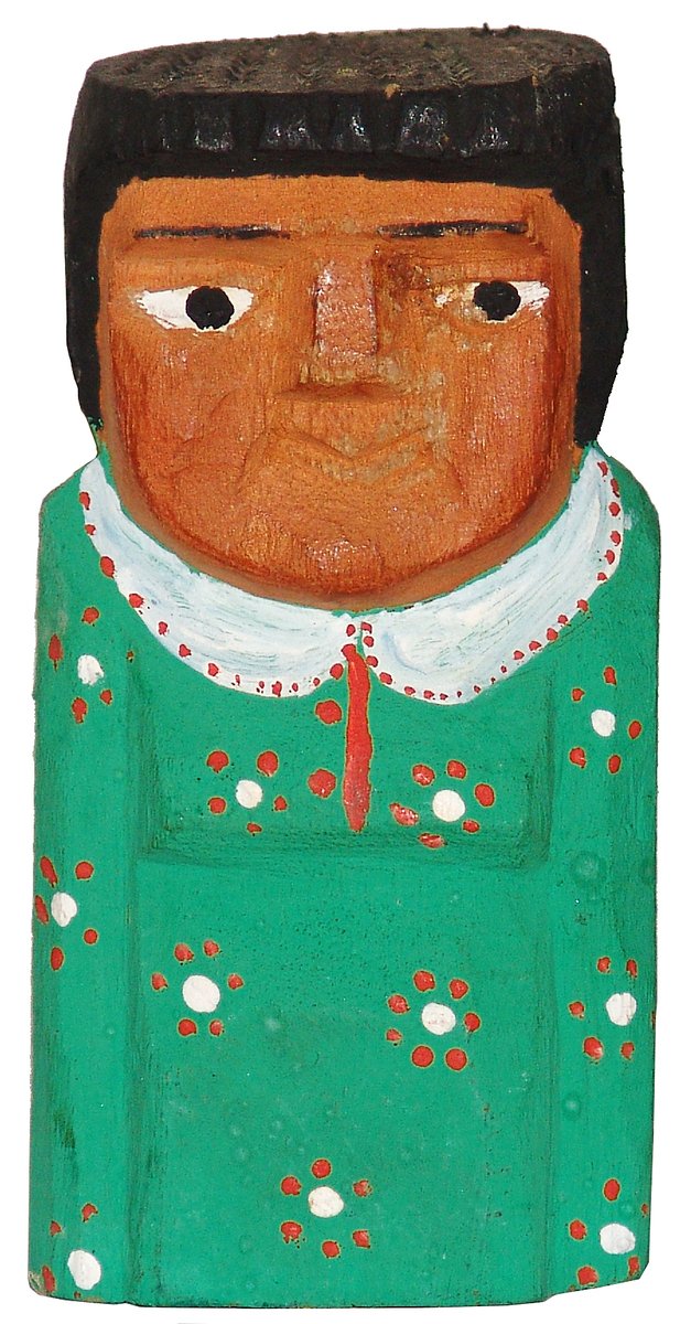 an old wood carved of a man in green clothing