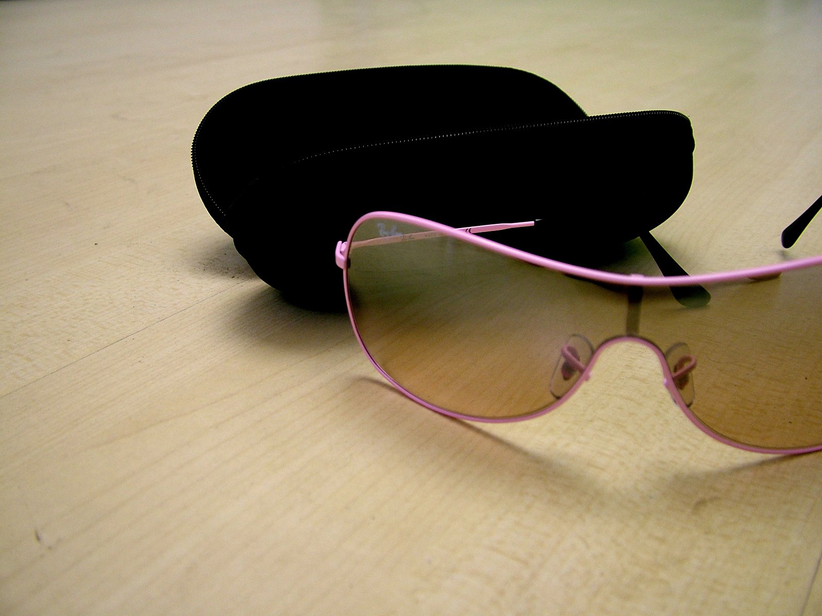a pair of glasses is laying on a table