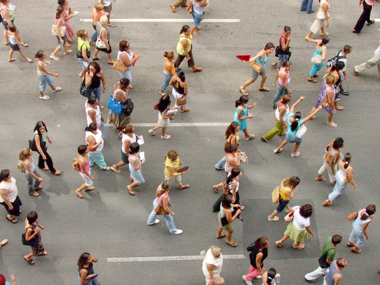 many people are walking around a street together