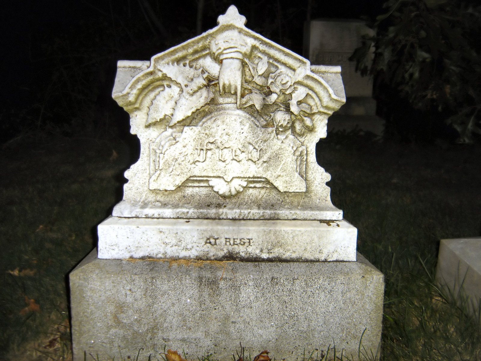 a cemetery with some headstones on the sides