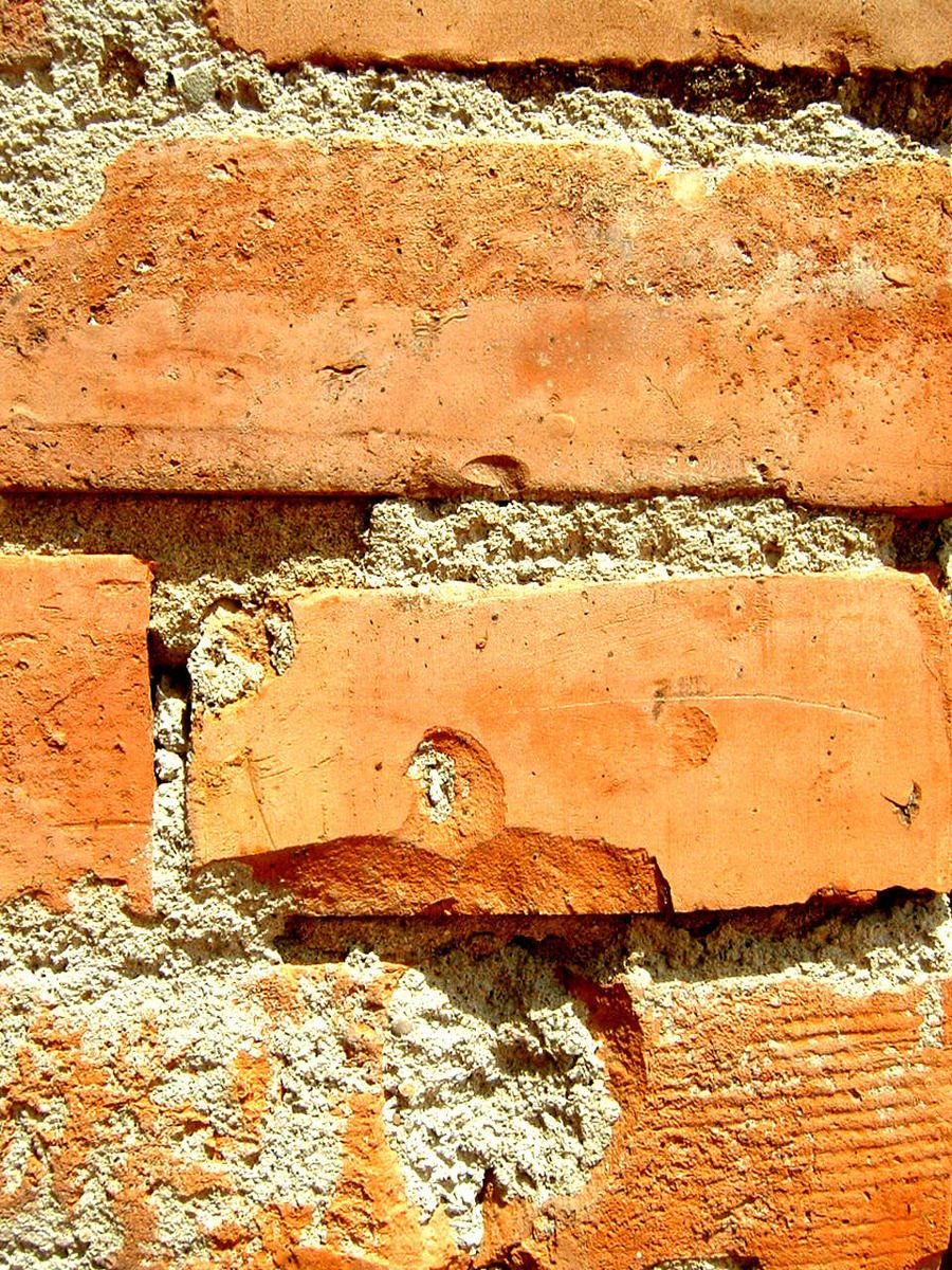 a close up of an orange brick building